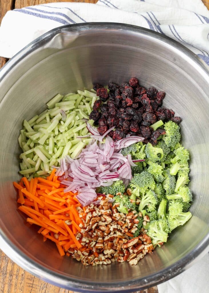 ingredients for broccoli slaw in metal mixing bowl