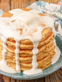 Carrot cake pancakes topped with cream cheese syrup