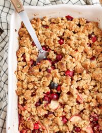 cranberry crisp with apples and large serving spoon
