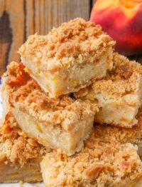 coffee cake stacked on plate with peaches