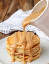 creamy peanut butter syrup pour shot over pancakes