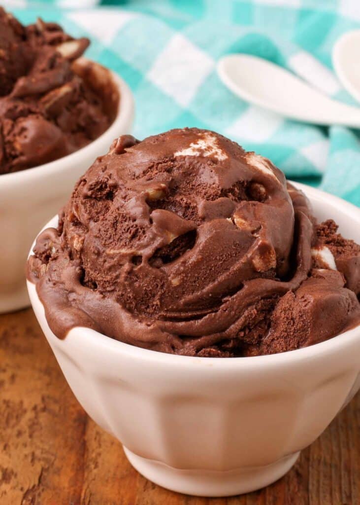 close up shot of chocolate ice cream in bowl with teal napkin