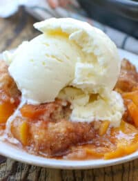 Southern Peach Cobbler is a summer dessert that we look forward to all year long - get the recipe at barefeetinthekitchen.com