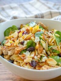 spinach salad with orzo, cranberries, and goat cheese