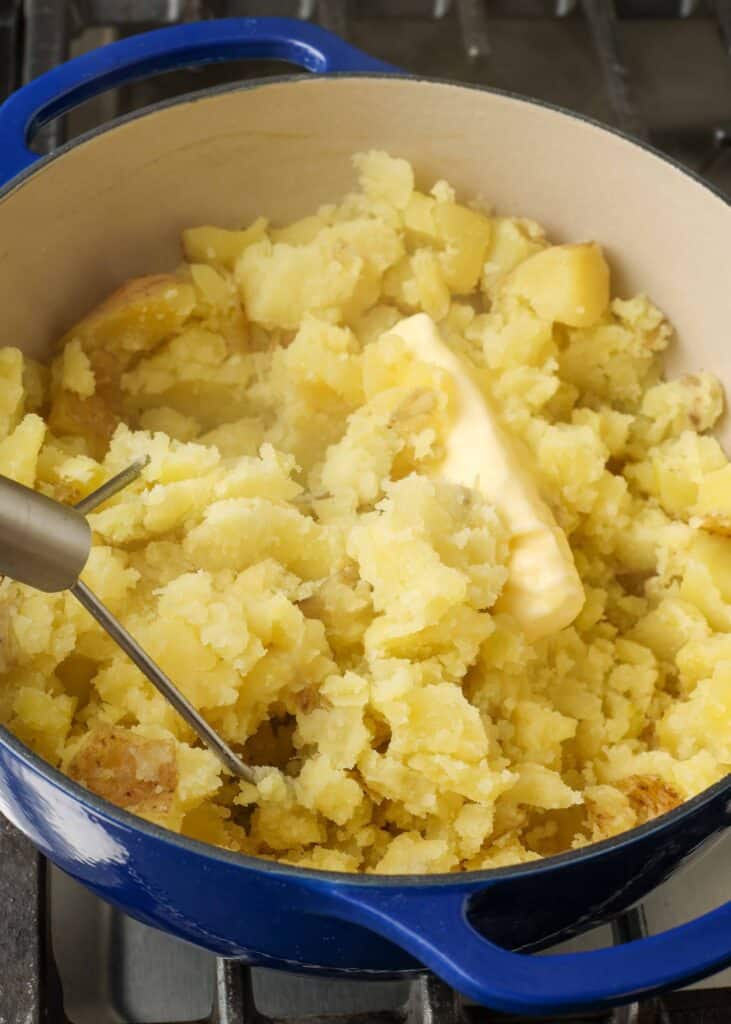 Butter melting in a pot of mashed potatoes