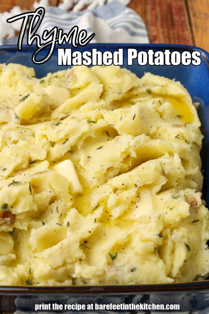 Buttery thyme mashed potatoes in a blue serving dish