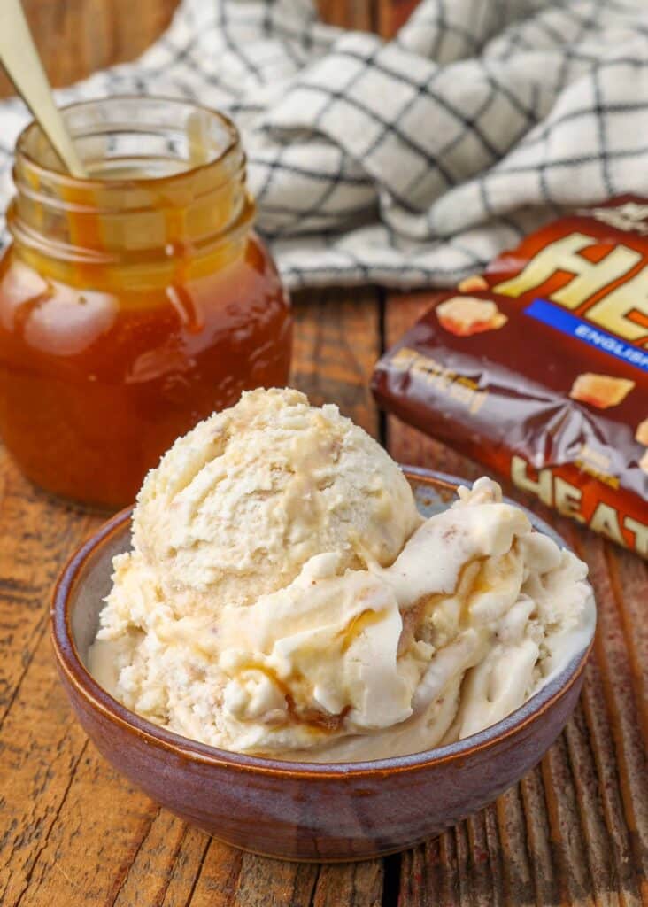 vanilla ice cream with jar of caramel sauce and package of toffee bits