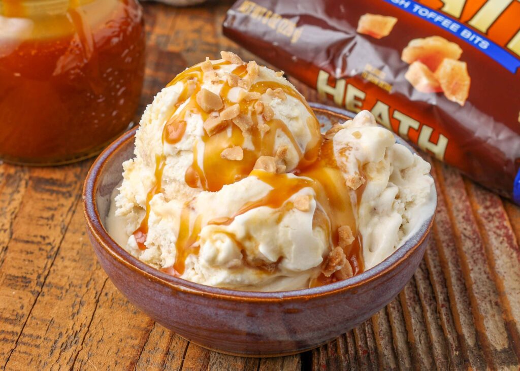 Close-up of toffee ice cream with caramel syrup and toffee bits